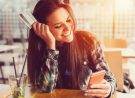 Young women in a cafe with credit card    +++++ Note for the inspector : Credit card is fake +++++
